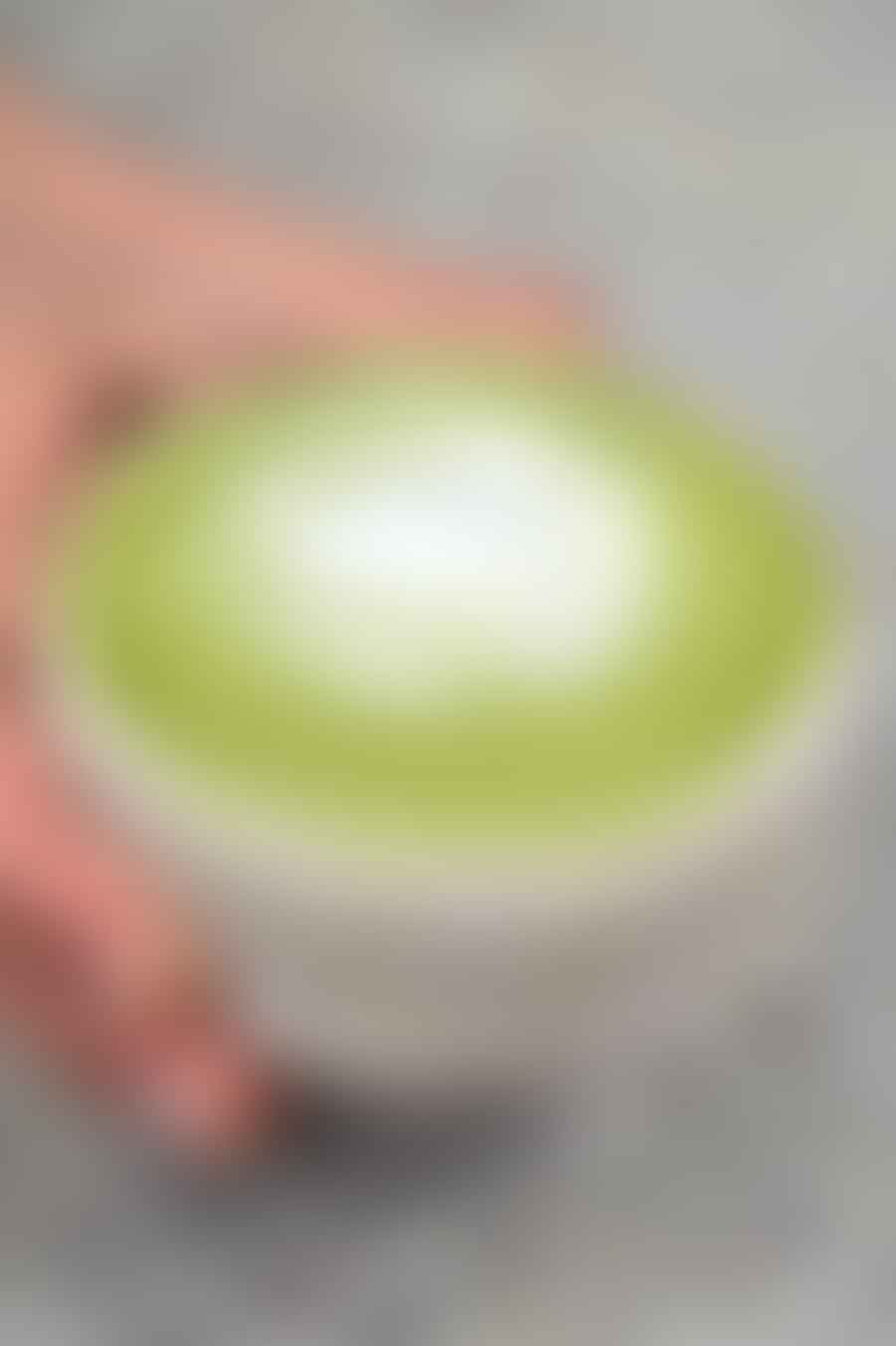 Pouring the milk into the matcha paste