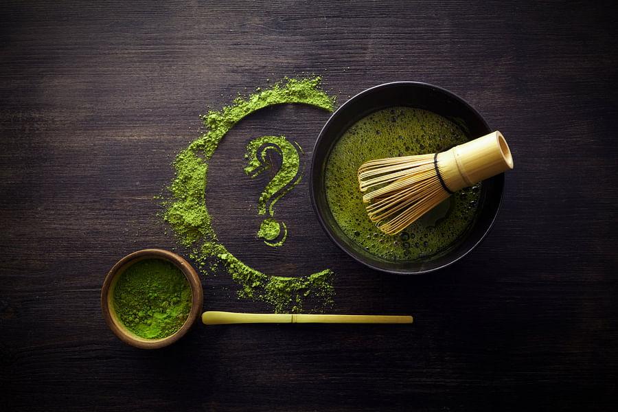 Different grades of matcha powder showcasing variations in color and texture