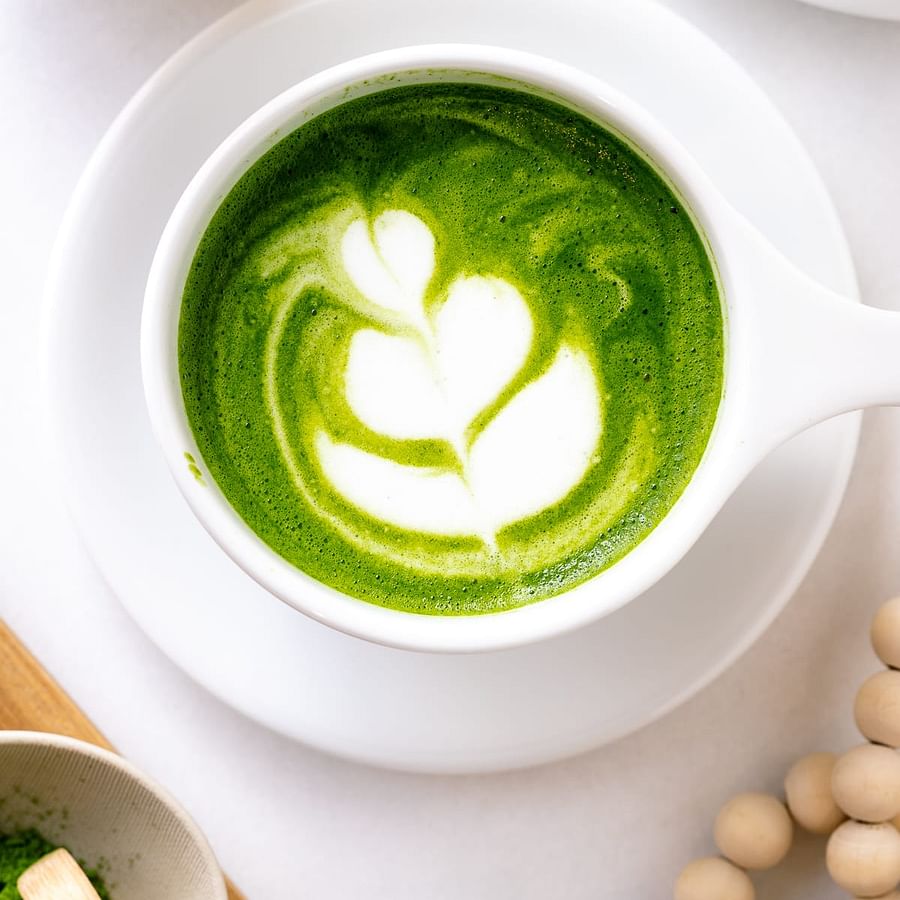 Vibrant green matcha tea in a cup
